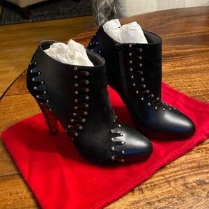 Size 39 black leather/swede Christian Lounoutin bootie.